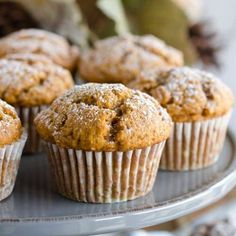 some muffins are sitting on a metal tray