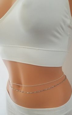 Simple Belly Chain, Belly Chain, Gold Belly Chain Simple and elegant! The newest trend in body jewelry, belly chains are super cute and easy to wear. Perfect on the beach or outfits. Comes elegantly in a gift box or cute organza bag, ready to give. ★Details: ~This listing is for one single layer chain of your choice. ~Available in a variety of designs and finishes. ~The chain is secured at the back with a clasp. ~ 2 inches adjustment chain will be added to the length you want. ~Water resistant ~ Cheap Metal Waist Chain, Dainty Silver Adjustable Waist Chain, Dainty Adjustable Silver Waist Chain, Silver Dainty Adjustable Waist Chain, Adjustable Silver Dainty Waist Chain, Trendy Silver Body Chain, Trendy Silver Body Chain Gift, Trendy Silver Body Chain For Gift, Dainty Silver Chain Body Jewelry