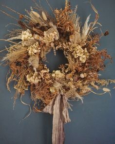 a dried wreath hanging on the wall