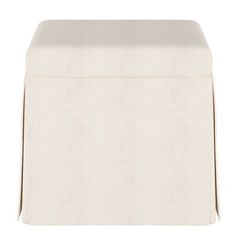 the foot stool is made out of linen and has a white cover on top of it