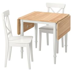 a wooden table and two white chairs next to each other on a white background,