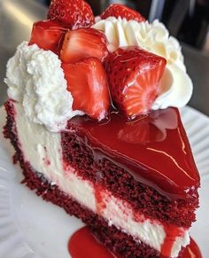 a piece of cake with strawberries on top