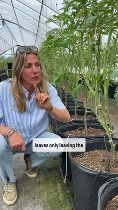 a woman kneeling down in front of some plants with the words leaves only leaving the plant