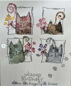 a card with three cats and flowers on it