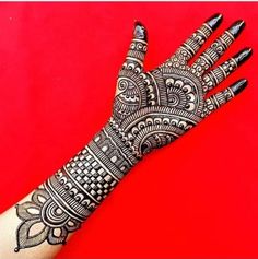 the hand is decorated with intricate designs