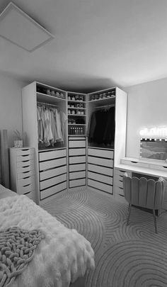 a bedroom with an open closet and dressing table