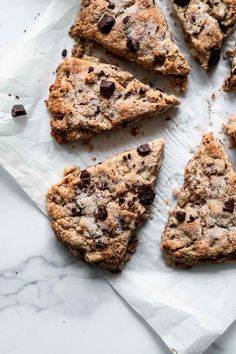 chocolate chip scones on parchment paper cut into eight pieces and placed on top of each other