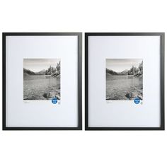 two black and white framed pictures with mountains in the background, one has a blue button on it