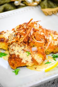 crispy veal cutlets with creamy dijon sauce on a white platter