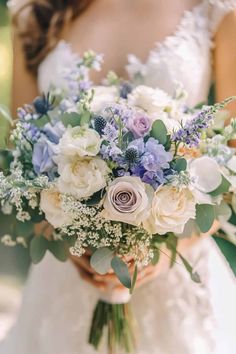 a bridal holding a bouquet of white and blue flowers