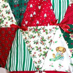 many different colored fabric pieces with red, green and white designs