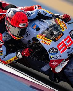 a person riding a motorcycle on a race track