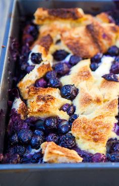 a blueberry cobbler is shown in a baking pan