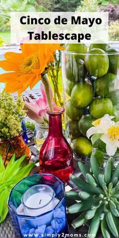 a table topped with vases filled with different types of flowers and plants next to each other