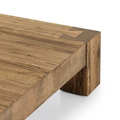 a close up of a wooden table with no one on it's legs or feet