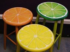 three small stools made to look like citrus fruits are sitting next to each other