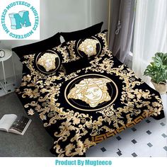 a bed with a black and gold comforter on it