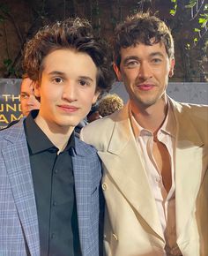 two young men standing next to each other