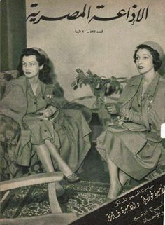 two women sitting next to each other on a couch