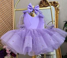 Sequined Purple Baby Dress With Ribbon, Tutu First Birthday Dress, Pageant Party Girl Dress, Toddler Puffy Dress, Baby Princess Dress This baby girl dress is specially designed and handmade for your baby girl. Your girl will be like a princess with these dresses that she can wear on special occasions such as birthdays, weddings and christmas. This dress, which will create your girl's style with a clasp and shoes, is ideal for special occasions. Check out our baby girl dresses selection for unique handmade dresses from AymiraDesign. ✿ Product Features; ✰ Baby Dress Materials: Tulle ✰ Baby Dress Color: Purple ✰ Set Content: Dress, Clasp ✰ Size Options: * 0-3 months, 3-6 months, 6-9 months, 9-12 months, 12-18 months, 18-24 months, 2T, 3T, 4T, 5, 6 US kids' numeric More from Baby Girl Dress Co Sweet Easter Party Dress, Sweet Easter Party Dresses, Cute Purple Baptism Dress, Cute Purple Dresses For Baptism, Cute Purple Dress For Baptism, Purple Summer Baptism Dress, Summer Purple Dress For Baptism, Summer Baptism Purple Dress, Purple Ruffle Dress For Baptism