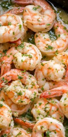 cooked shrimp with herbs in a skillet