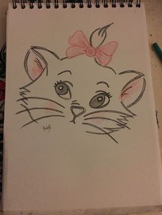 a drawing of a cat with a bow on it's head is shown in pencil