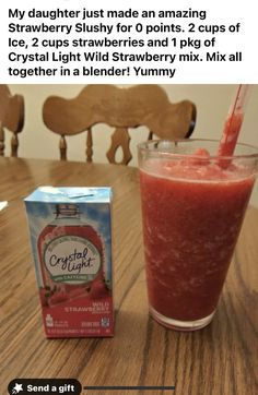 a box of cranberry slushy next to a drink on a table