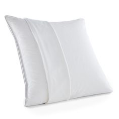 three pillows stacked on top of each other in front of a white background with the same pillow