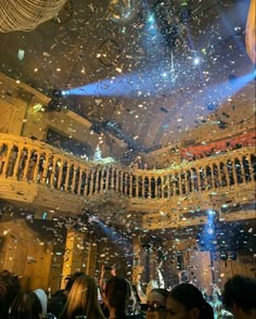 the ceiling is filled with confetti as people look up at them from below