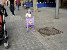 a small child sitting in a purple chair