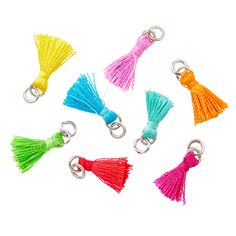 six different colored tassels with metal hooks