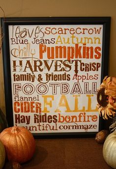 a framed halloween print with pumpkins and other fall decorations