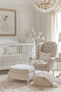 a baby's room with a crib, rocking chair and ottoman