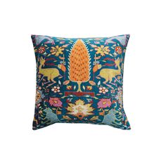 a blue pillow with an orange and yellow design on it