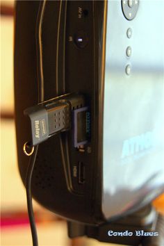 a close up view of the side of a computer with a usb cable plugged into it