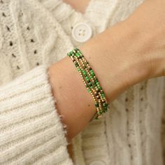 I added a pop of colour to my Classic gold bead bracelet and it is the perfect addition to a dainty stack. The beads are strung on a premium stretch cord. You will love this Green Shades MixSOLD BY ONE BRACELET or Set of fourITEMS DETAILS:Water Resistant -Nickel-free - Allergy-free- 18K gold plated brass beads made to last- round bead size: 2mm- Glass seed beads 2mm- stretchy elastic cord, no clasp, designed to fit wrist sizes from 6 - 7 inches Trendy Hand-strung Gold Friendship Bracelets, Trendy Gold Hand-strung Friendship Bracelets, Gold Beaded Bracelets With Faceted Beads For Friendship, Trendy Gold Stretch Bracelet With Faceted Beads, Gold Bead Bracelet, Rainbow Loom Bands, Green Beaded Bracelets, Miyuki Bracelet, Green Shades