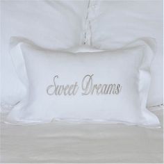 a white pillow with the words sweet dreams on it