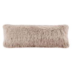 a long furry pillow on a white background