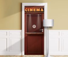 an open door to a room with a sign that says cinema on the front and side