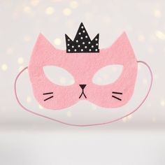 This Princess Kitty mask is a fun way to start a playtime adventure or create a fun party theme for a child who loves cats. It could also be used to enhance a Halloween costume, create a "cat look" for a dance recital, or be used for a fun photo prop for a group of children. A mask is a great way to encourage a child to use their imagination. Give them a place to start, with a mask, and then listen, as they make up a story about the Princess Kitty, or tell you where she might live or what she mi