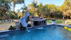 a pool with a slide and water features