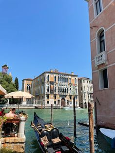 a gondola on the water in front of some buildings