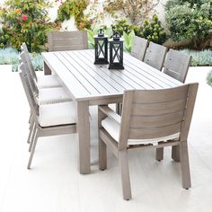 an outdoor table and chairs on a patio