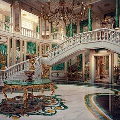 an elaborately decorated foyer with chandelier and marble floors