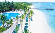 an aerial view of the beach and pool area