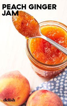 peach ginger jam in a glass jar with two peaches on the side and a spoon next to it