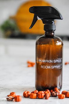 a bottle of pumpkin spice room spray sitting on a counter