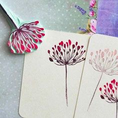 three cards with red and white flowers on them