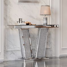 an elegant console table with marble and metal accents