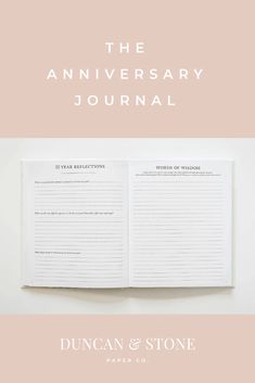 an open book with the words, the anniversary journal written in white and pink on it